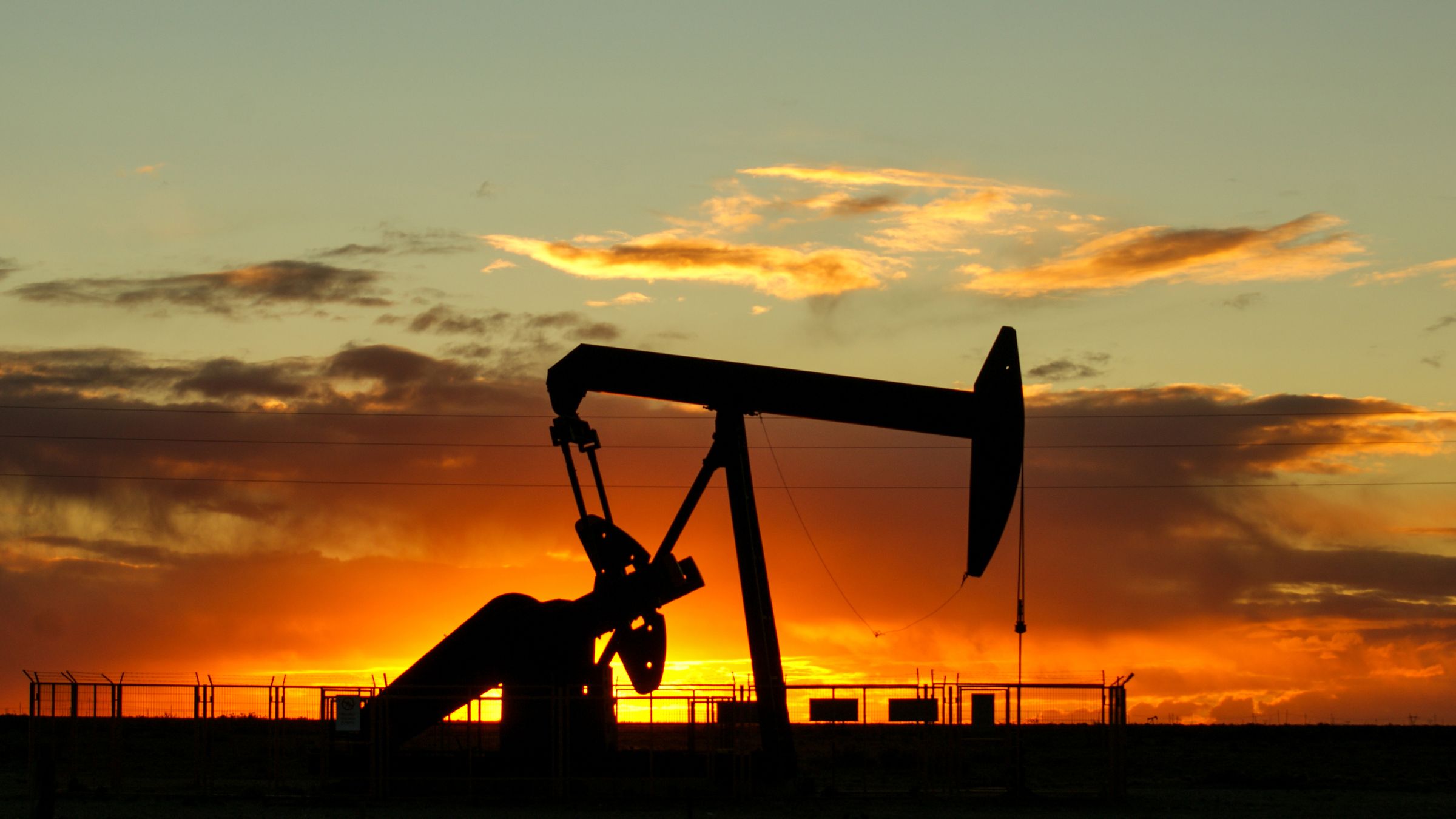 Oil pumpjack at sunset
